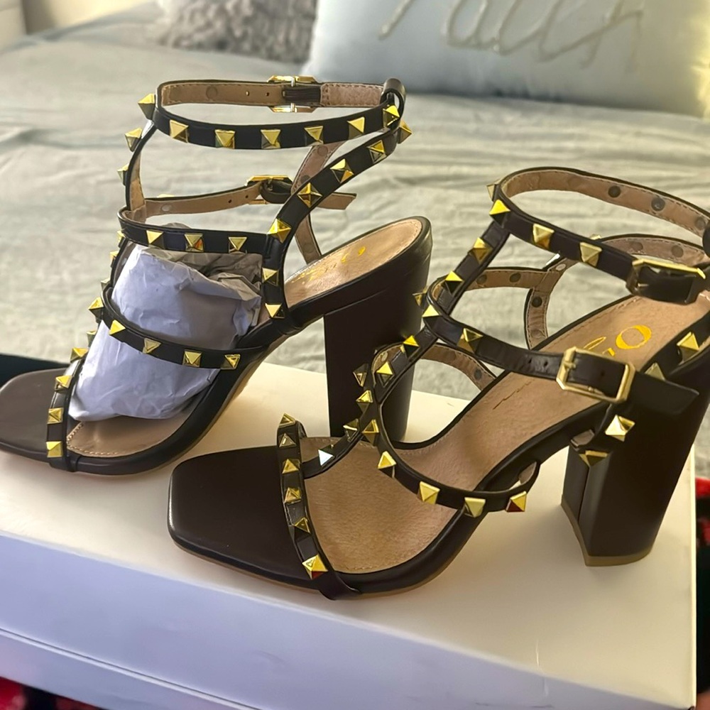 New Brown leather, gold studded heels. Double buckle straps, 3” heels. SZ 5.5